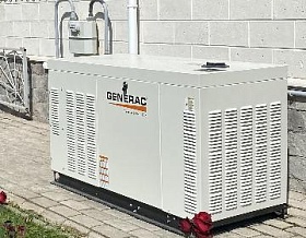 Монтаж газовой электростанции Generac RG 27 3P на отмостке дома